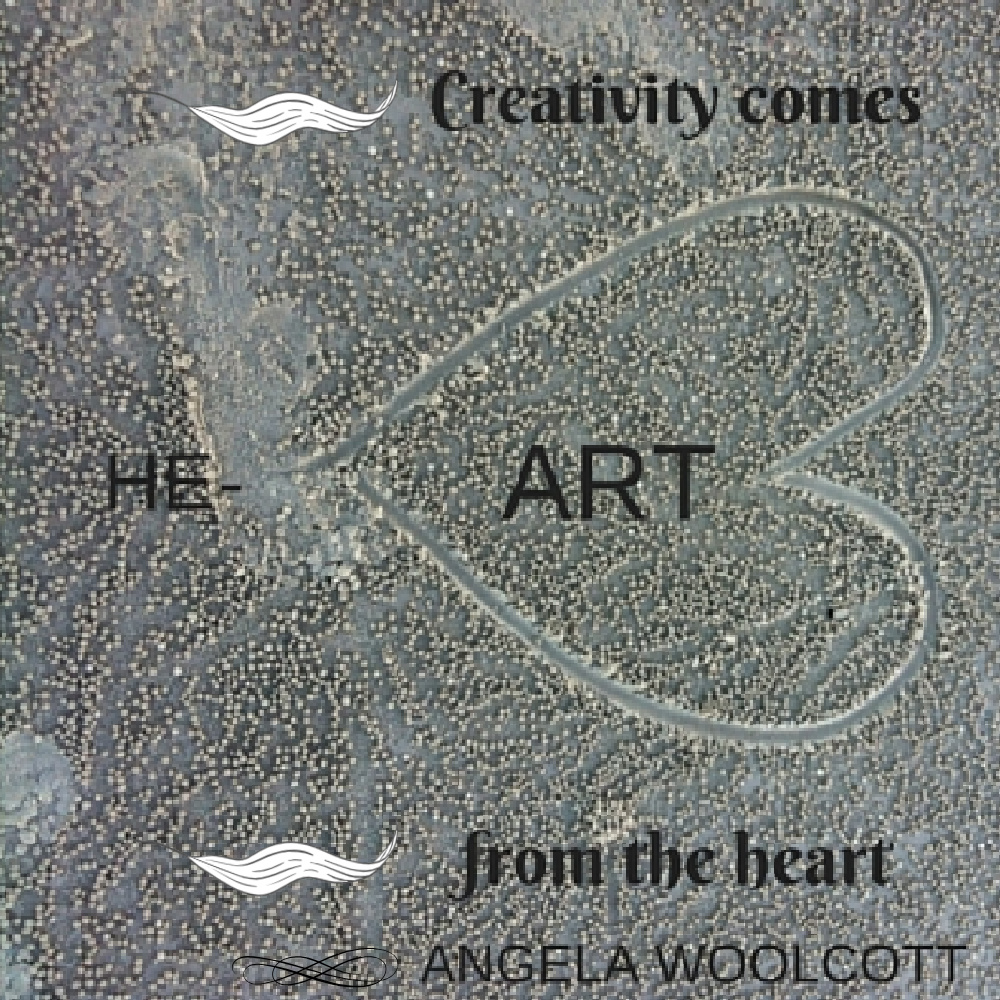 Picture of sand with a heart drawn on it. Quote: Creativity comes from the heart, Angela Woolcott.