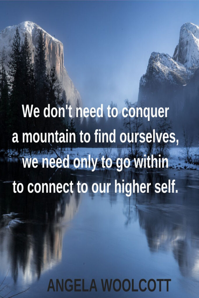 Photo of a mountain reflecting in water, with a quote about connecting to one's higher self superimposed on it.