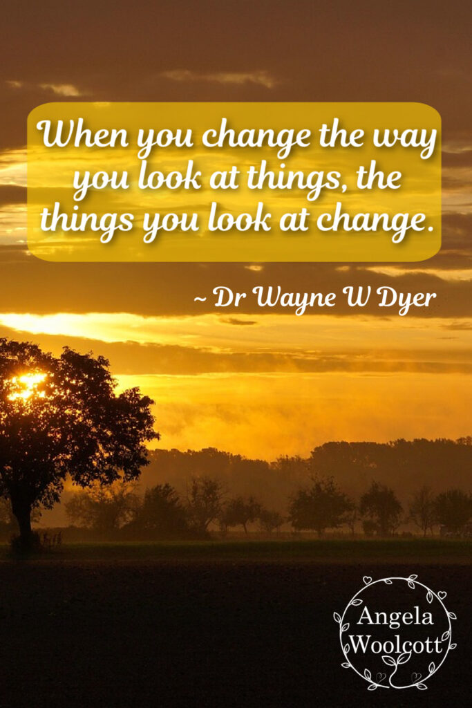 Image of a tree in the distance, with a field and shrubs, trees in the distance, and an inspirational quote.