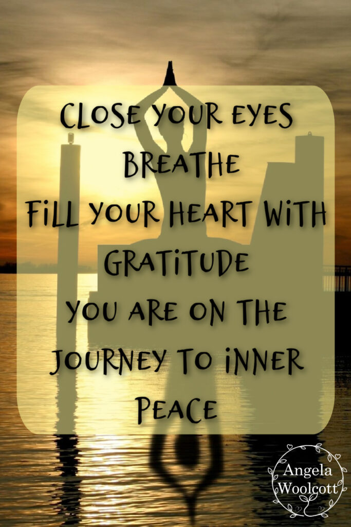 Silhouette of a person meditating near water on sunset with positive quote.