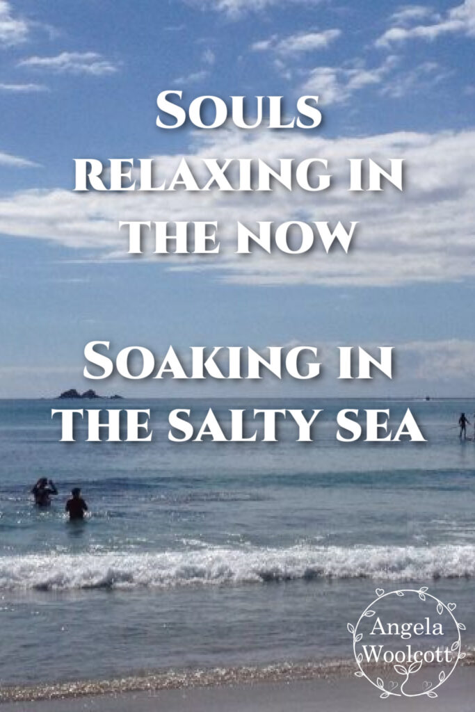Byron Bay ocean, people swimming, paddling with positive quote.