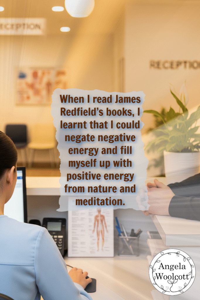 A female secretary with her back to the camera sits at a reception counter, looking at a computer screen. Across from her, a male patient stands, with only his torso visible, talking to her. The setting is a clean, modern doctor's clinic. Quote:When I read James Redfield’s books, I learnt that I could negate negative energy and fill myself up with positive energy from nature and meditation.
