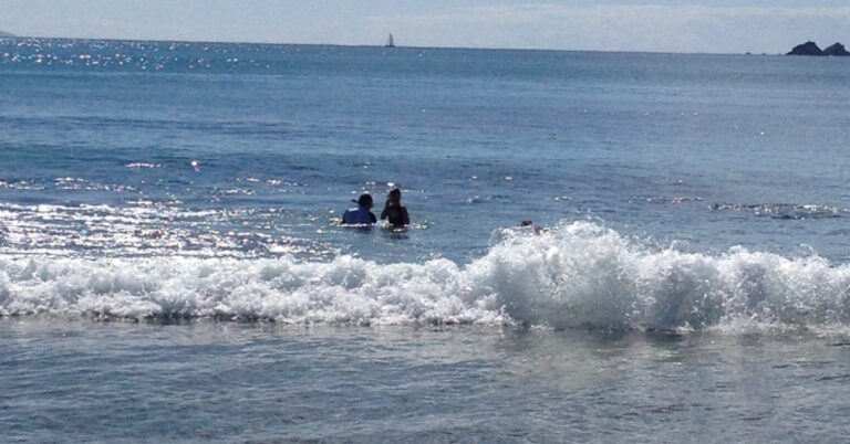 Two people snorkelling in ocean, Byron Bay.