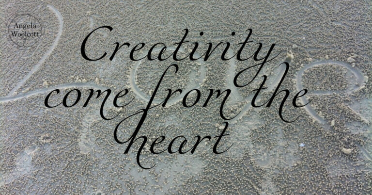 The word Love carved in sand with a positive quote overlaid.