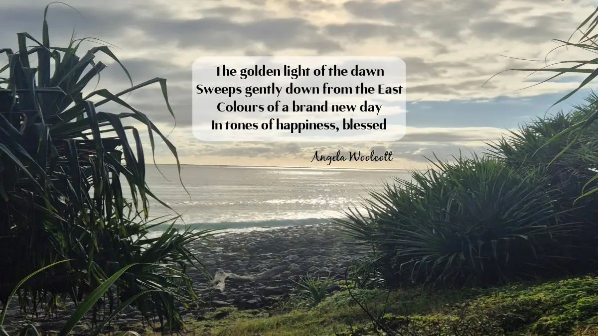 featured wordpress following the sun poem Following The Sun poem by Angela Woolcott featuring a coastal sunrise over the ocean framed by tropical foliage and rocky shores.